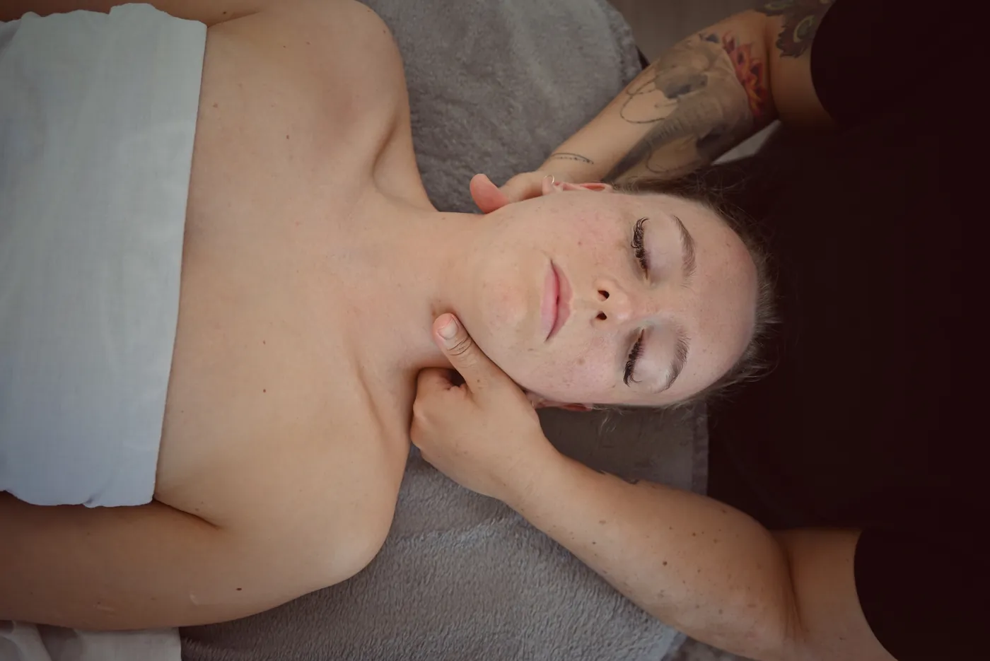 A neck and shoulder massage with the client lying face up